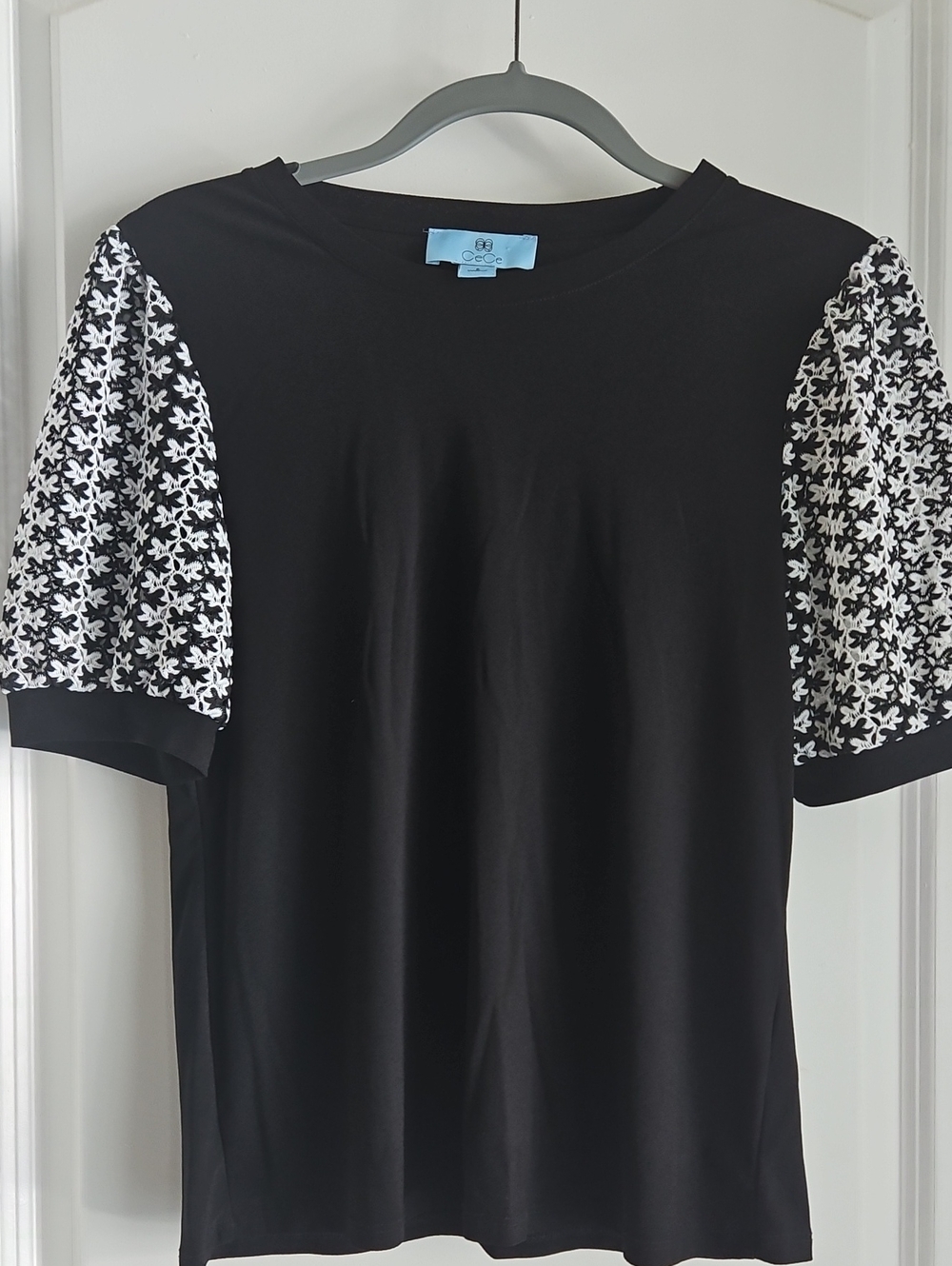 CeCe Black Tee with Black-and-White Patterned Puff Sleeves